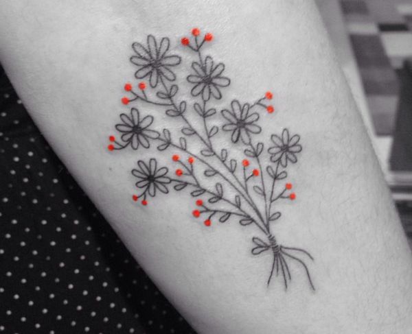 Gänseblümchen Tattoo Design am Unterarm