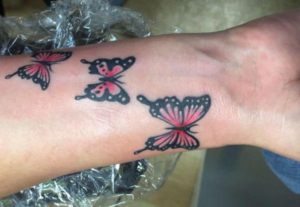 Schmetterling Tattoo Design am Unterarm