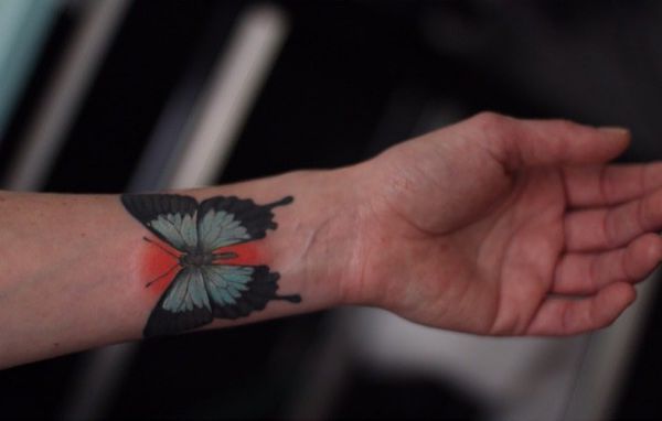 Ulysses Schmetterling Tattoo am Handgelenk