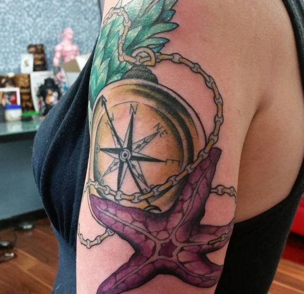 Seestern mit Kompass auf dem Arm