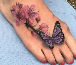 Realistische Schmetterling mit Kirschblüten Tattoo am fuß